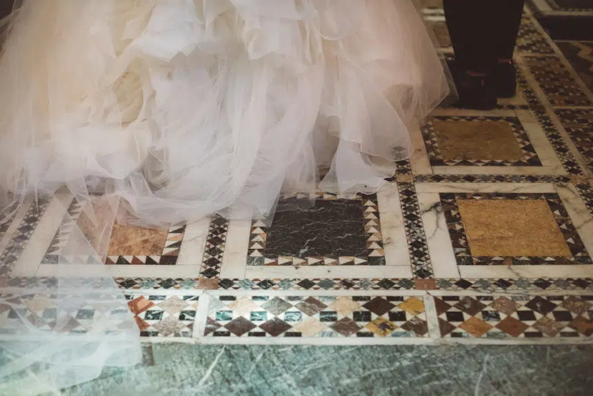 Bride and groom's feet on the mosaic floor of the Fitzrovia Chapel London